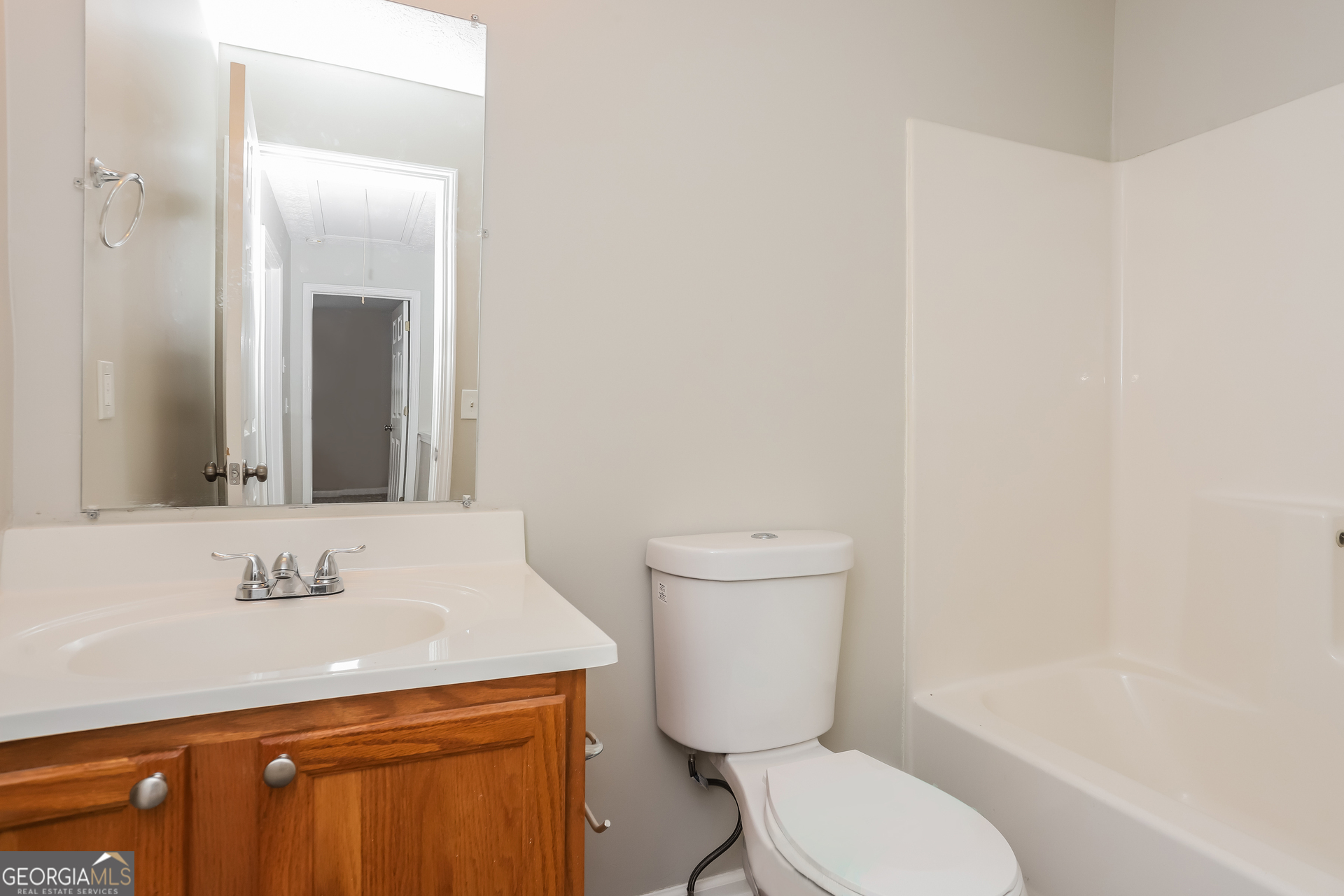688 Windcroft Circle Northwest Acworth, GA 30101 - Photo 13 of 17 a bathroom with a sink a toilet and mirror