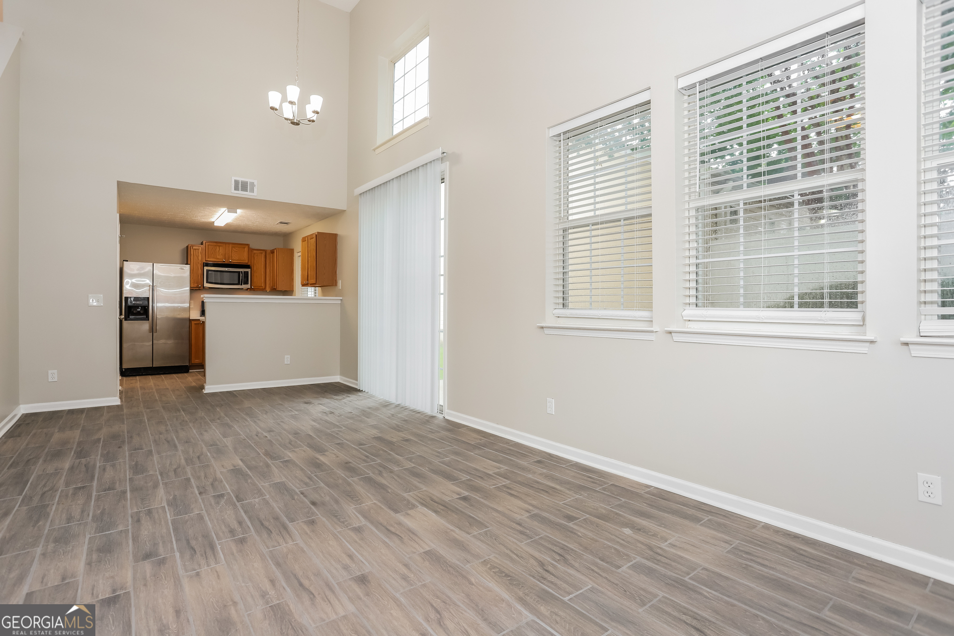 688 Windcroft Circle Northwest Acworth, GA 30101 - Photo 4 of 17 a view of empty room with wooden floor and window