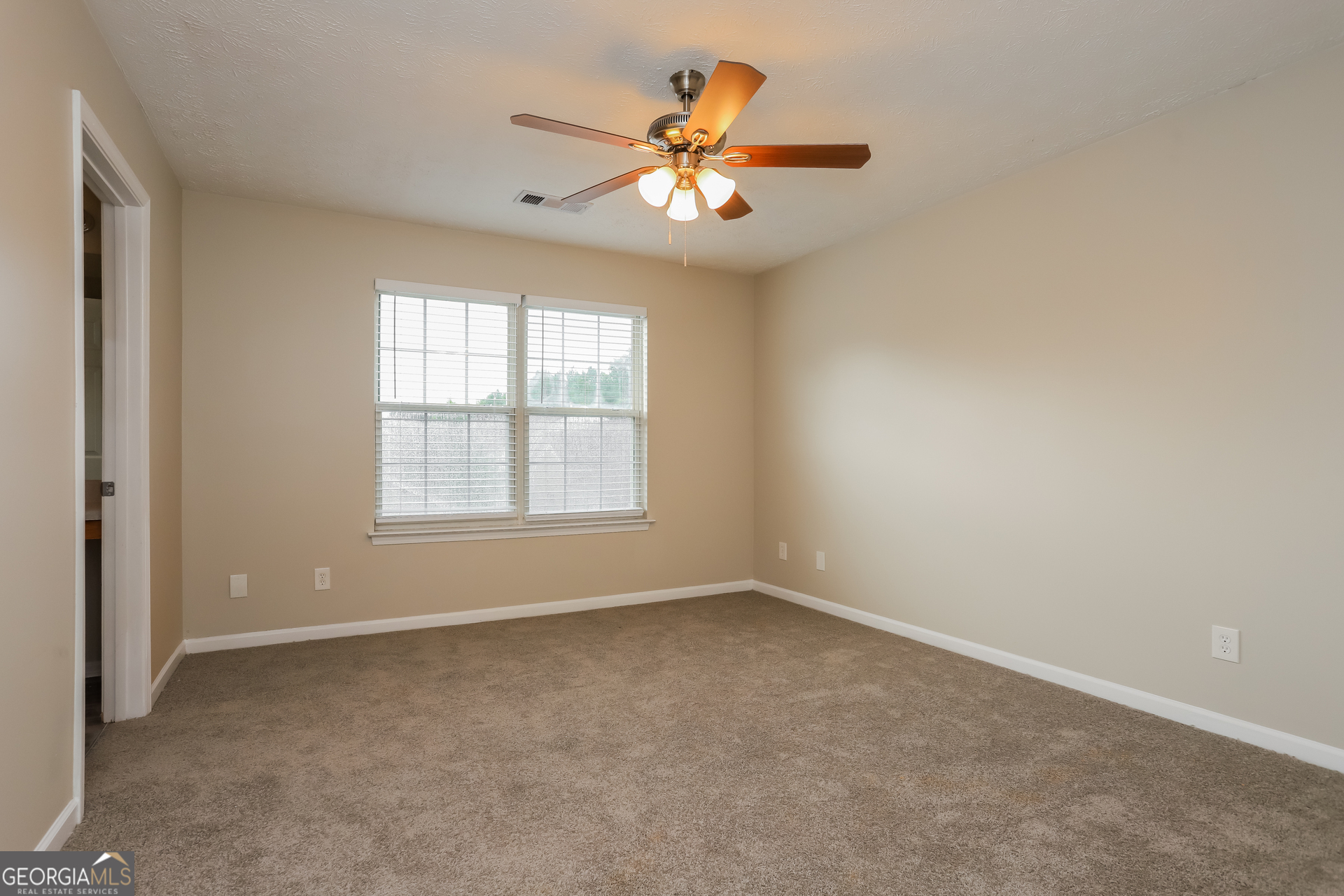 688 Windcroft Circle Northwest Acworth, GA 30101 - Photo 10 of 17 a view of an empty room with a window