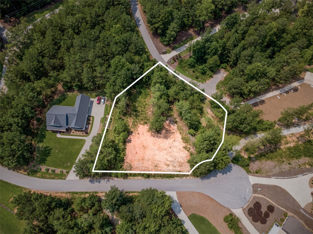 Lot 24 Reservoir Road West Union, SC 29696 - Photo 1 of 46 A spacious, undeveloped lot awaits your vision, framed by mature trees and ready for construction.