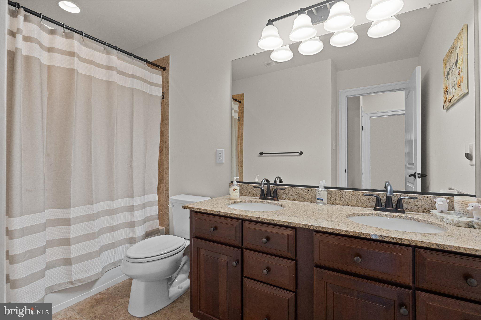3842 Jacob Stout Road Doylestown, PA 18902 - Photo 25 of 68 a bathroom with a double vanity sink mirror and toilet