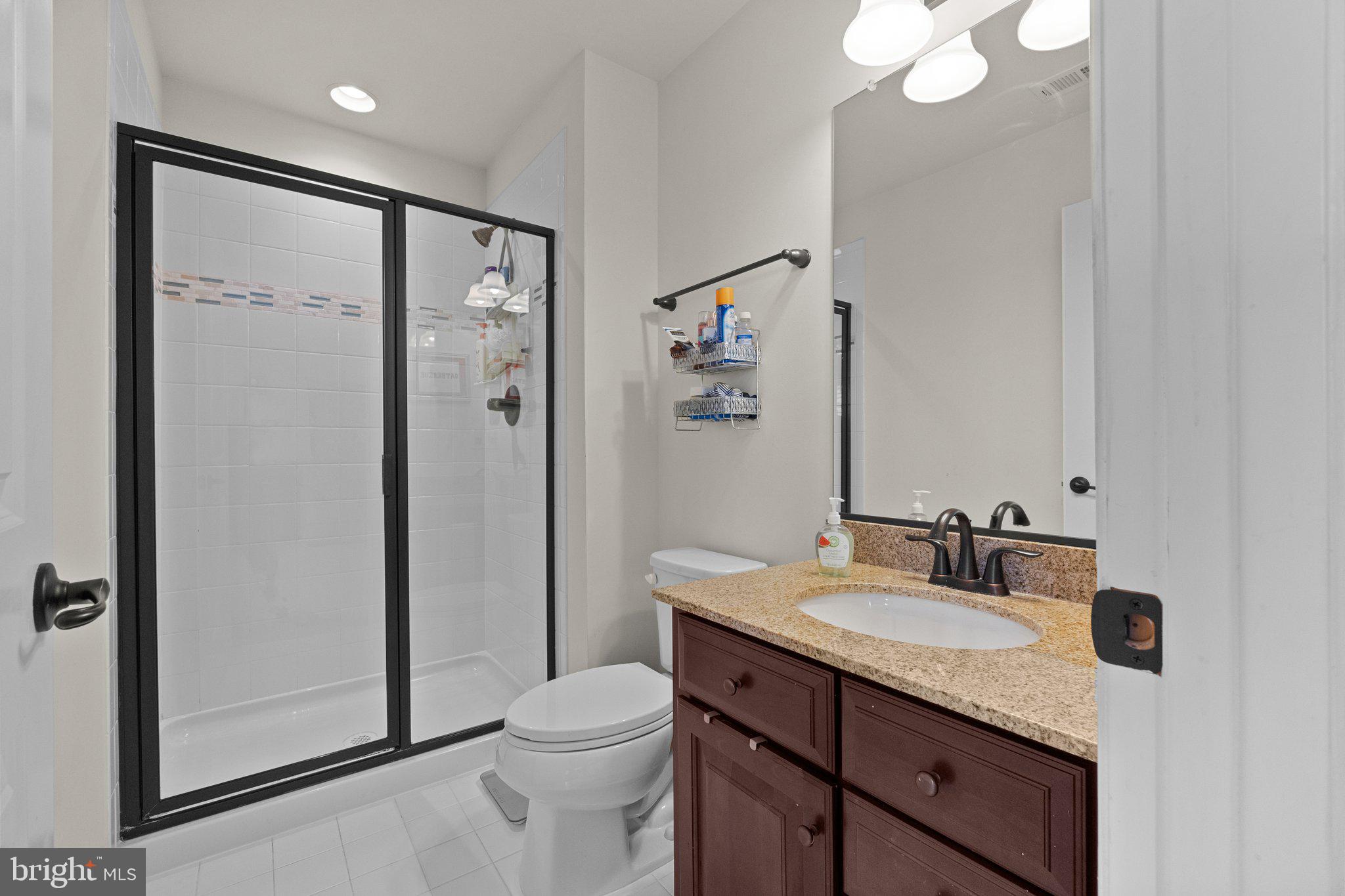 3842 Jacob Stout Road Doylestown, PA 18902 - Photo 30 of 68 a bathroom with a granite countertop sink toilet and shower
