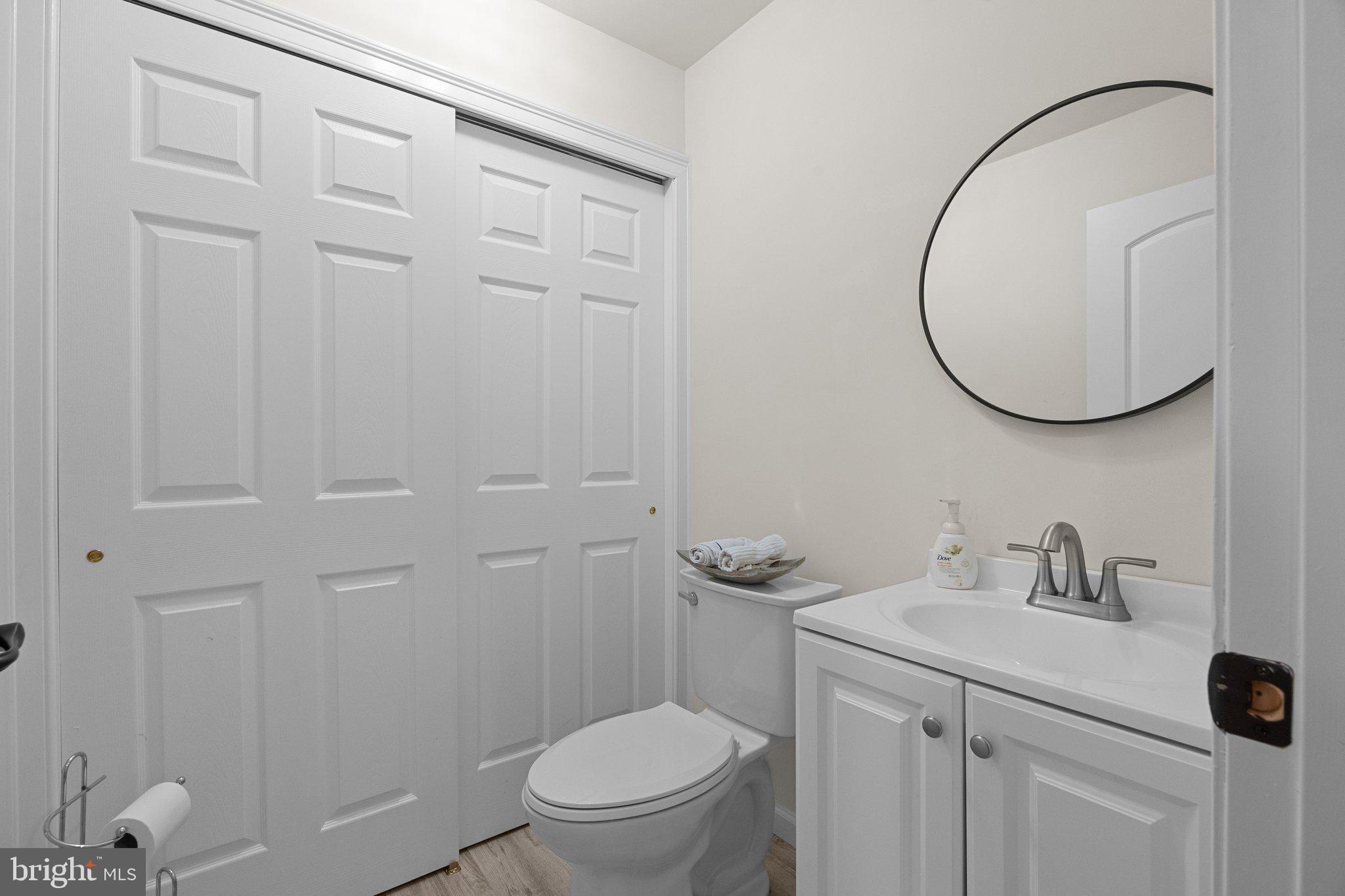 3842 Jacob Stout Road Doylestown, PA 18902 - Photo 38 of 68 a bathroom with a toilet sink vanity and mirror