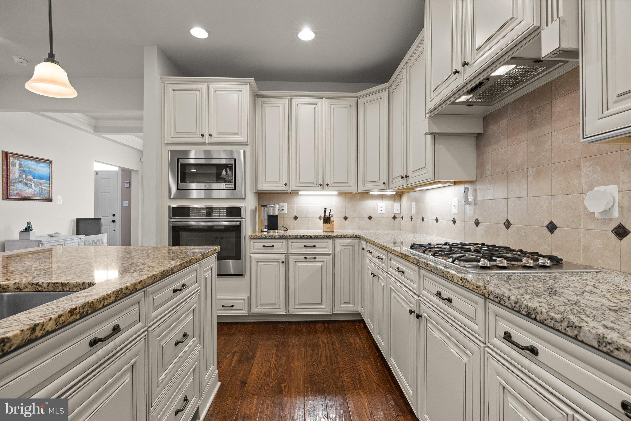 3842 Jacob Stout Road Doylestown, PA 18902 - Photo 8 of 68 a kitchen with stainless steel appliances granite countertop a stove sink and cabinets