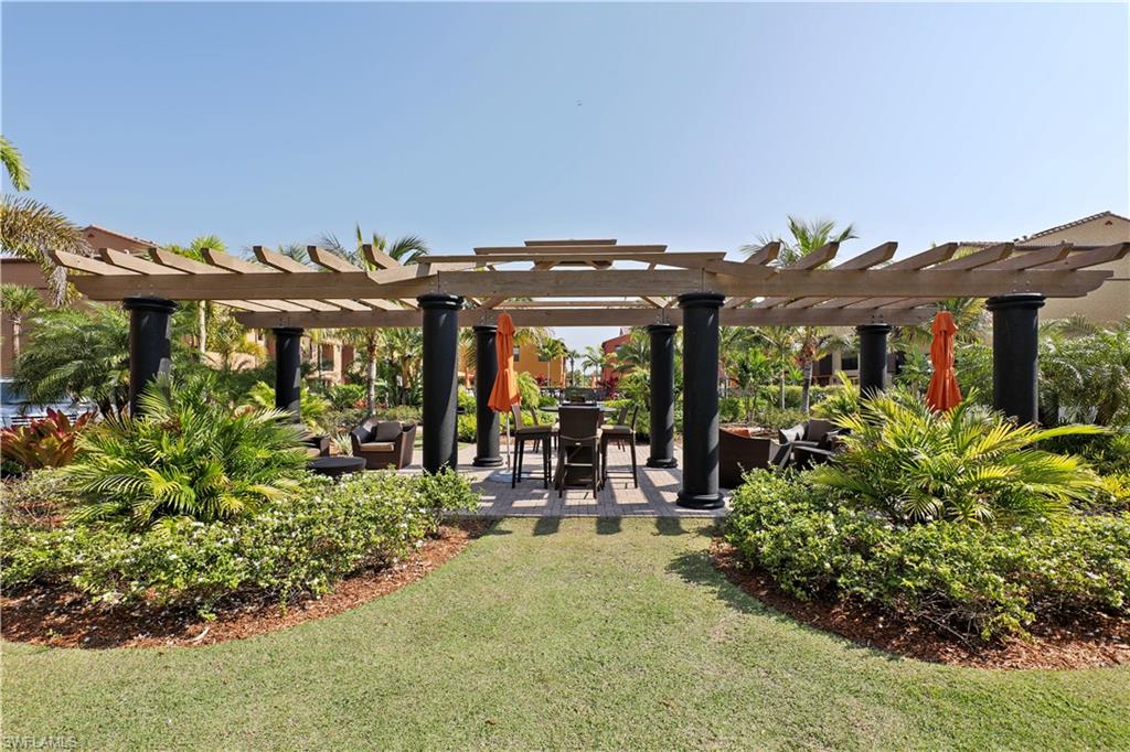 9051 Capistrano Street North, Unit 4308 Naples, FL 34113 - Photo 15 of 20 an outdoor space with patio