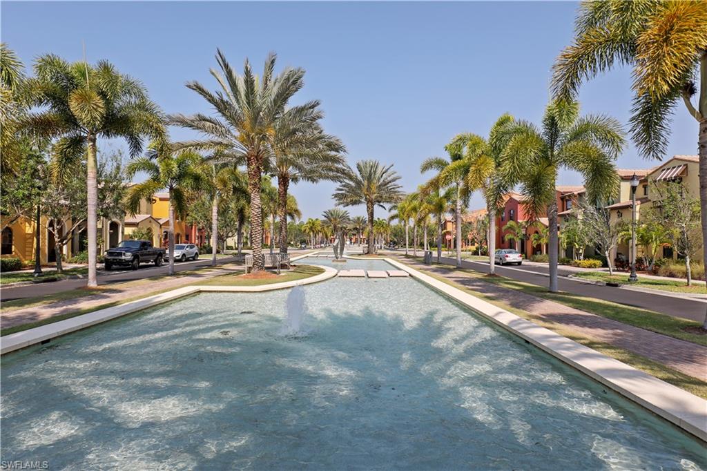 9051 Capistrano Street North, Unit 4308 Naples, FL 34113 - Photo 16 of 20 a view of road with palm trees