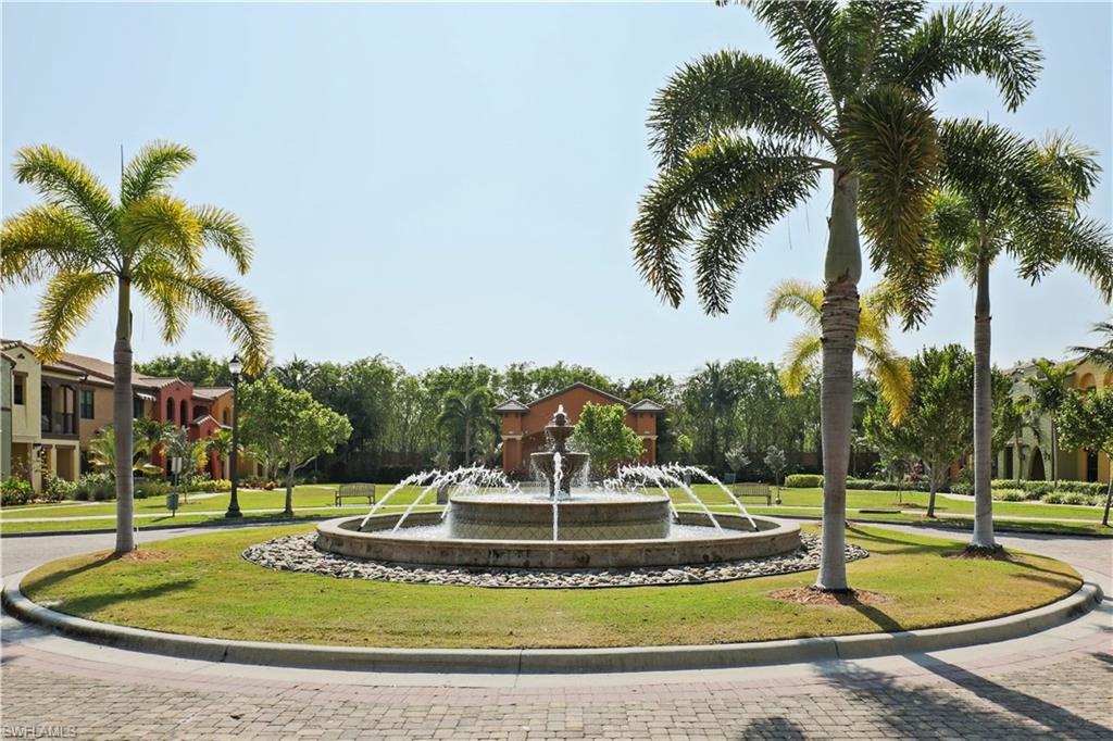 9051 Capistrano Street North, Unit 4308 Naples, FL 34113 - Photo 17 of 20 a view of a swimming pool with a house
