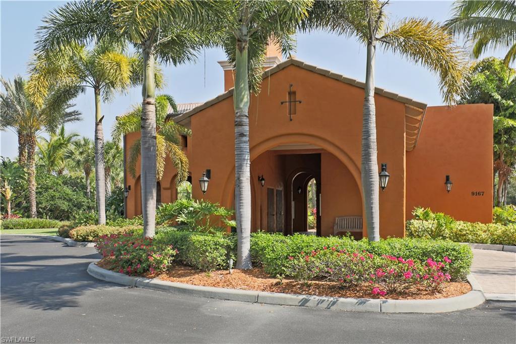 9051 Capistrano Street North, Unit 4308 Naples, FL 34113 - Photo 19 of 20 a front view of a house with a garden