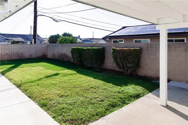 a view of a backyard of the house