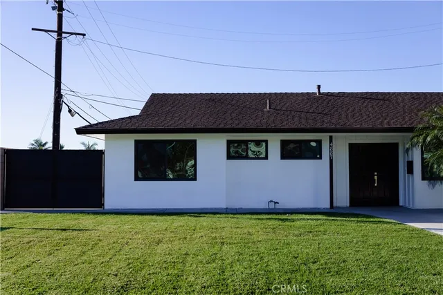 a bathroom with a shower a toilet and a window