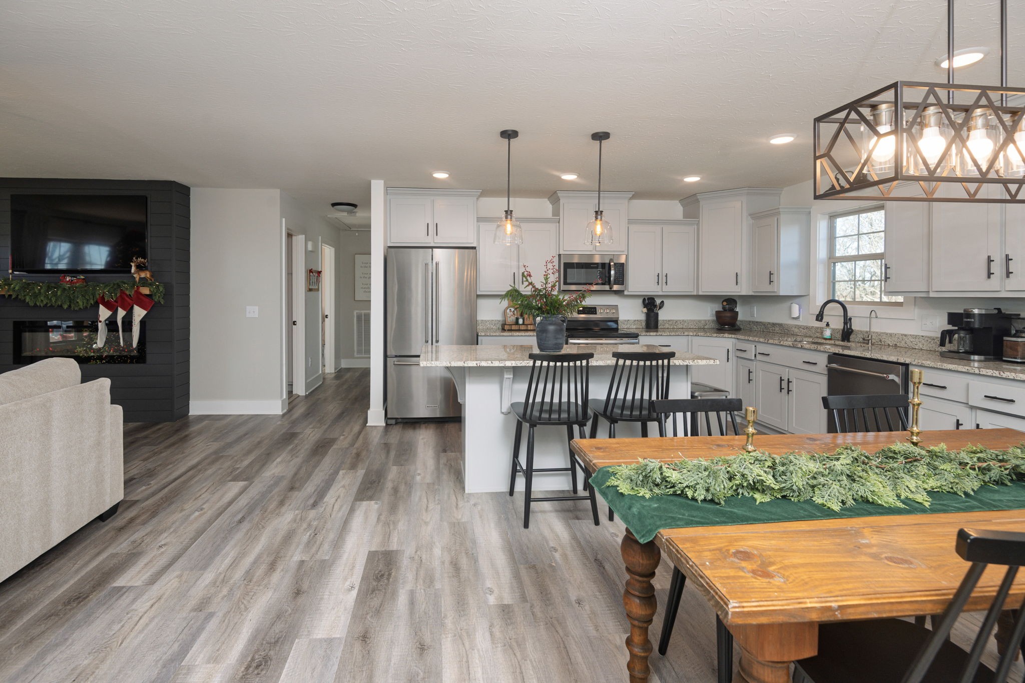 720 Armstrong Road Castalian Springs, TN 37031 - Photo 14 of 45 a living room with furniture a large window and wooden floor
