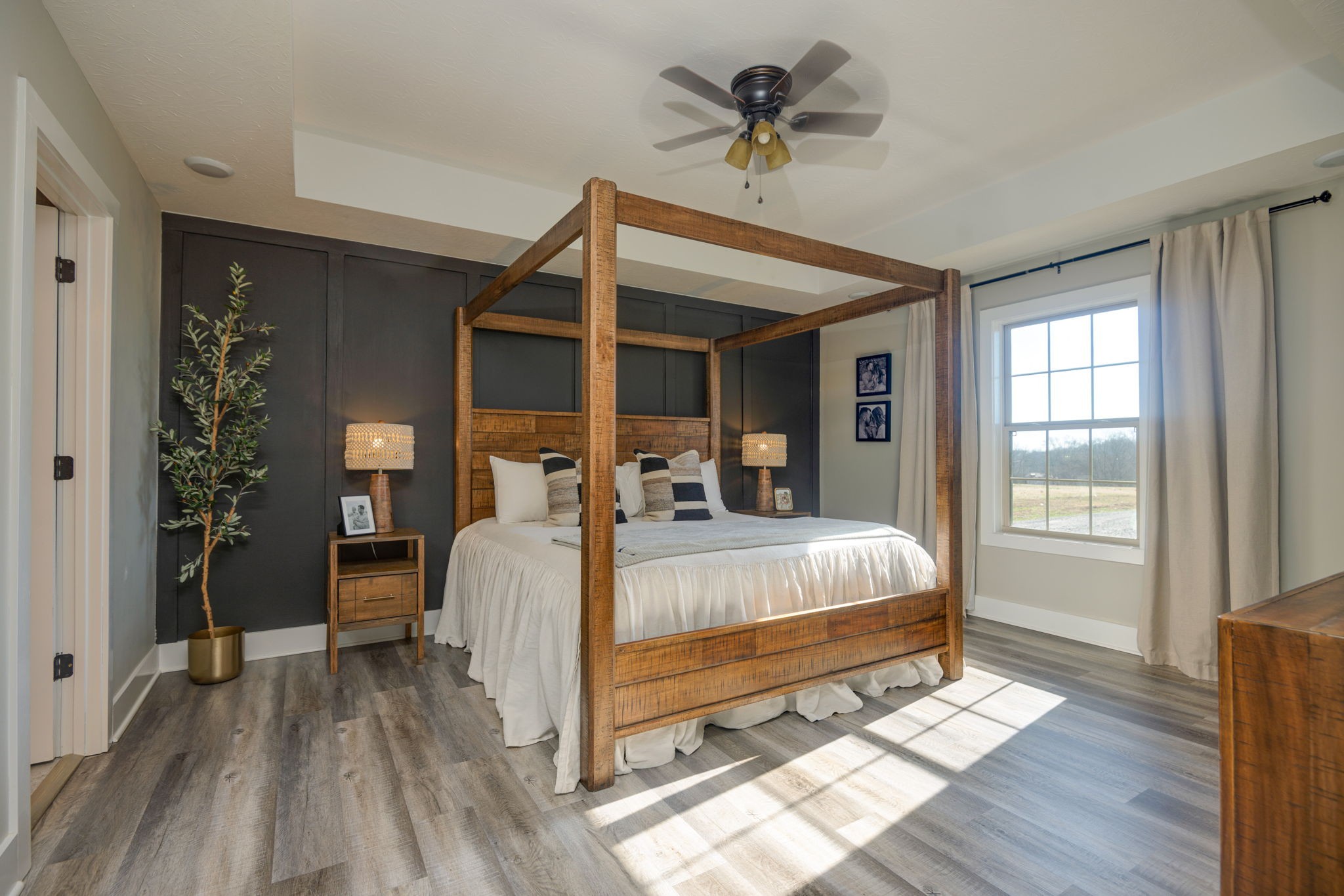 720 Armstrong Road Castalian Springs, TN 37031 - Photo 20 of 45 a bed sitting in a spacious bedroom next to a window