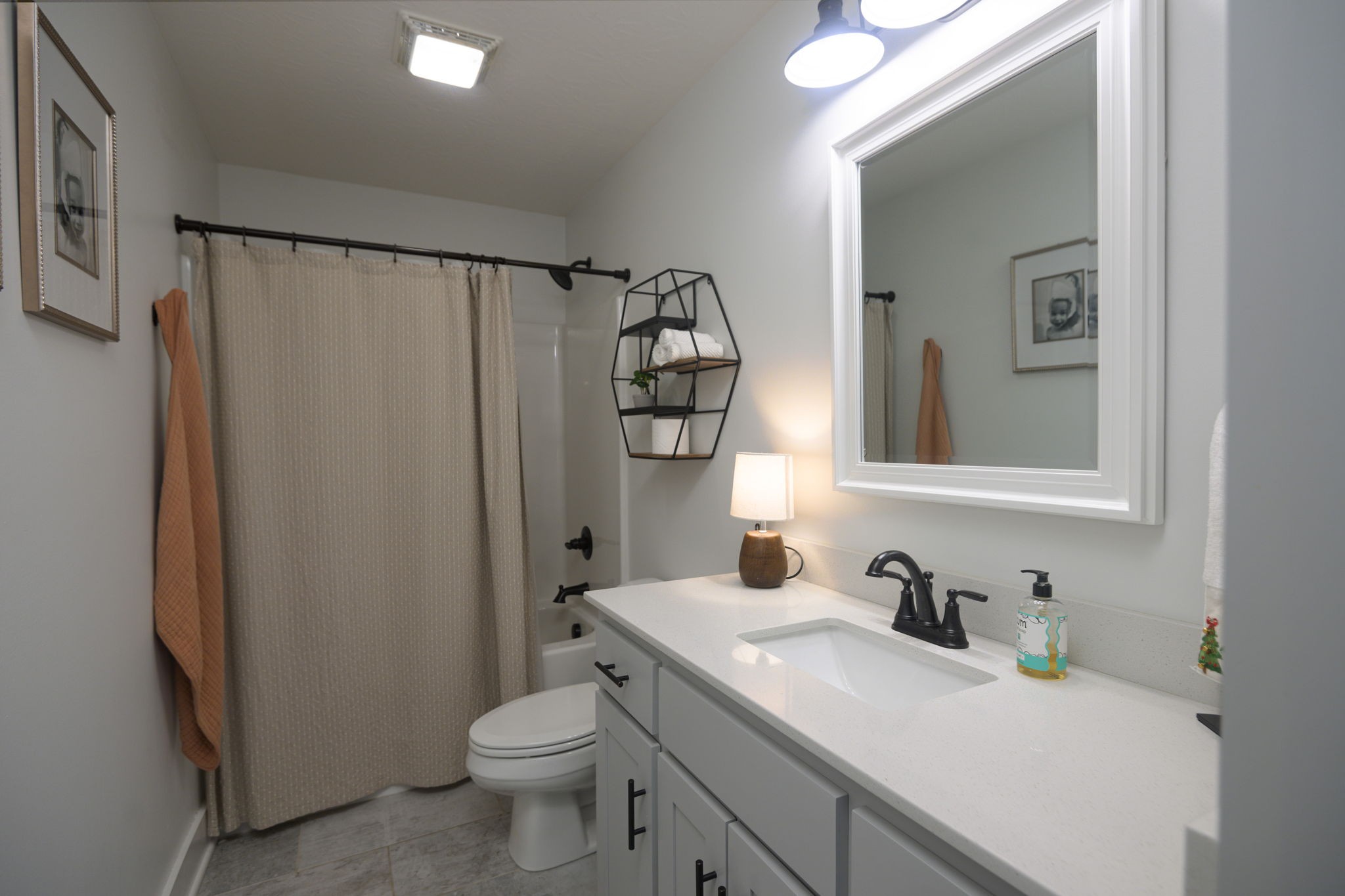 720 Armstrong Road Castalian Springs, TN 37031 - Photo 35 of 45 a bathroom with a granite countertop sink toilet and shower