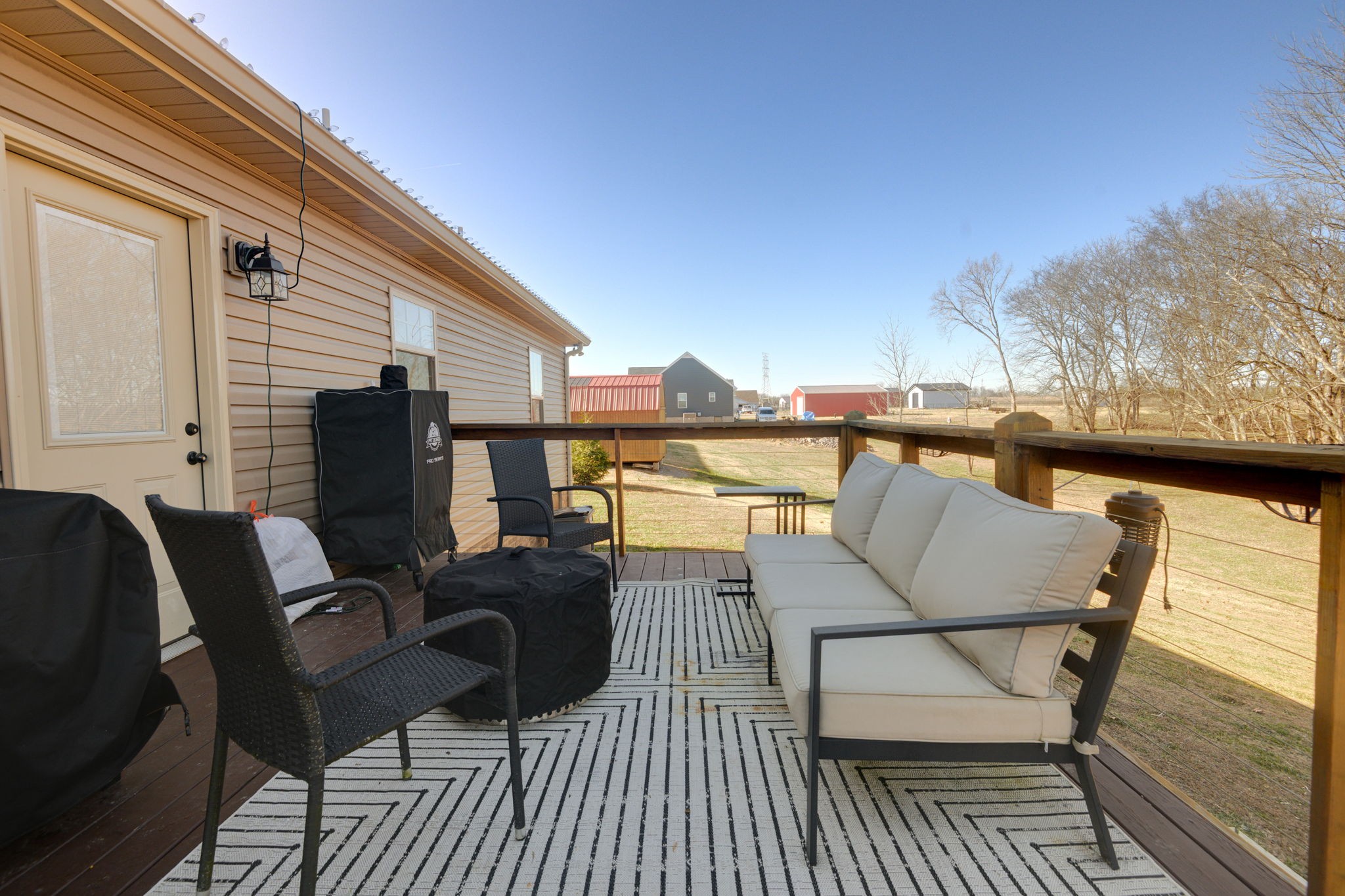 720 Armstrong Road Castalian Springs, TN 37031 - Photo 38 of 45 a balcony with furniture and wooden floor