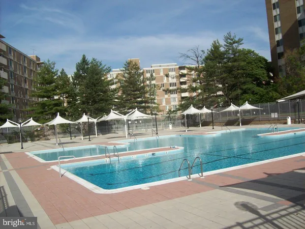 a view of a swimming pool with a garden