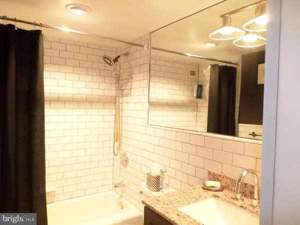 a bathroom with a shower and a bathtub