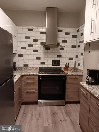a kitchen with cabinets and appliances