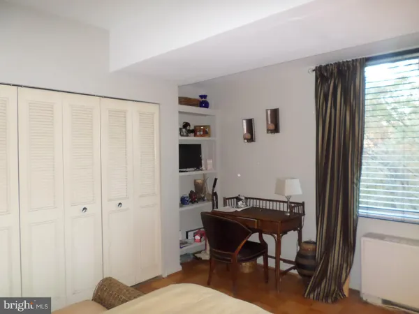 a workspace with furniture and a window