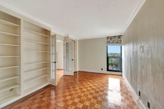 a bathroom with a granite countertop sink a mirror and shower