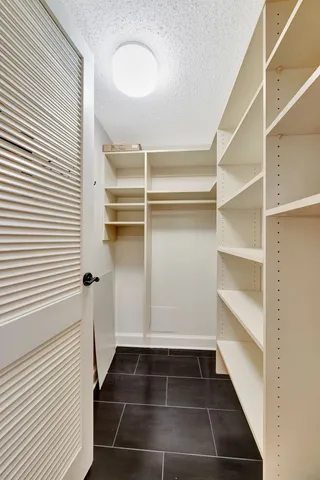 a view of a hallway with closet