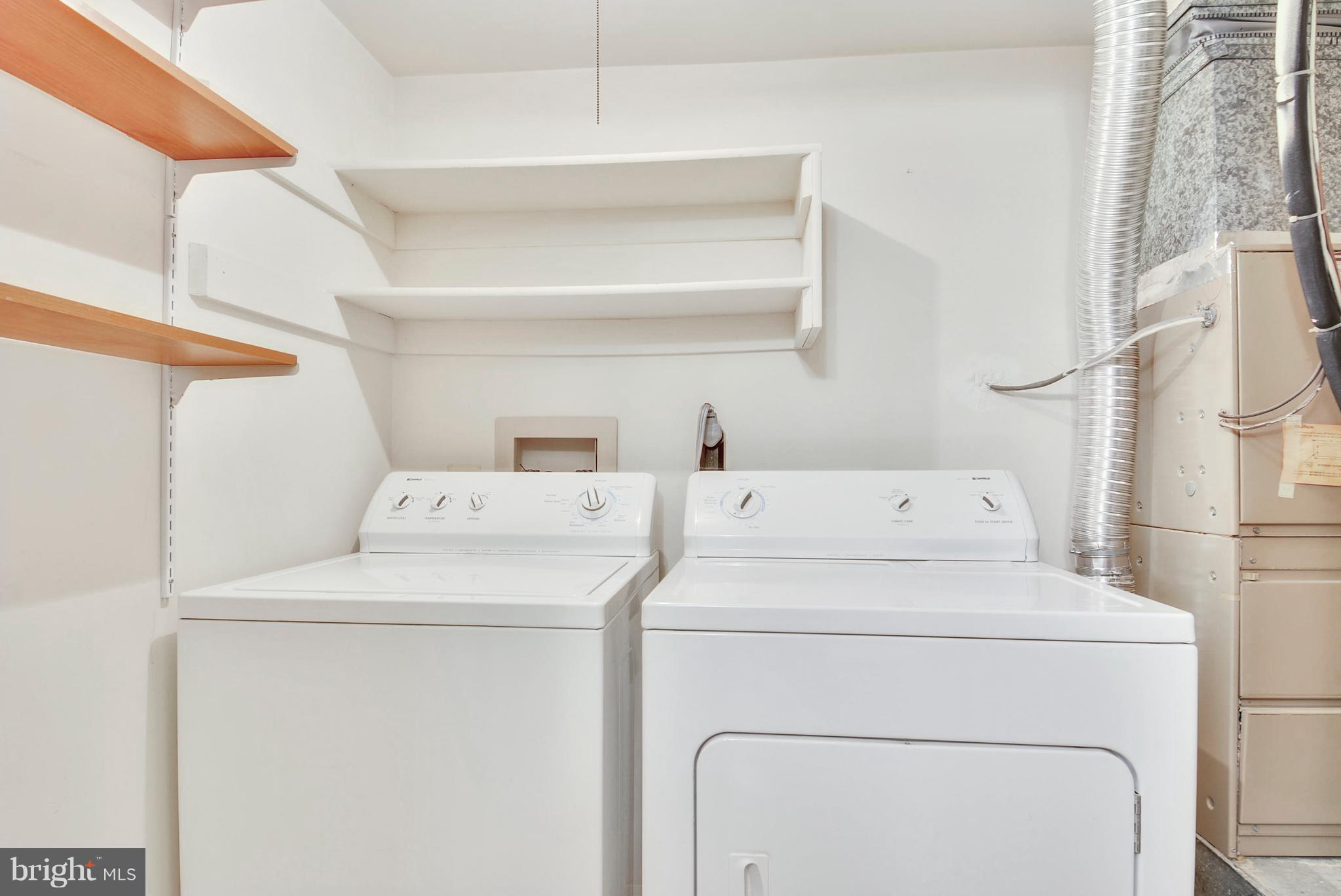 127 Fort Evans Road Southeast, Unit F Leesburg, VA 20175 - Photo 13 of 21 In-Unit Laundry Room w/ Overhead Shelving