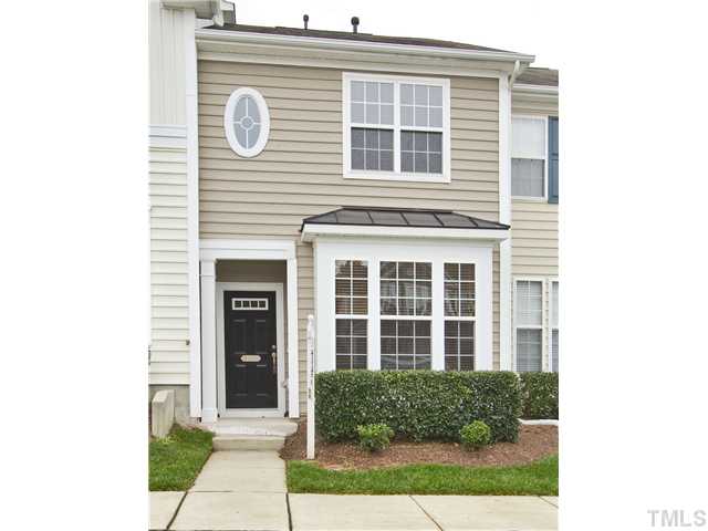 7843 Spungold Street Raleigh, NC 27617 - Photo 19 of 20 a front view of a house with a yard