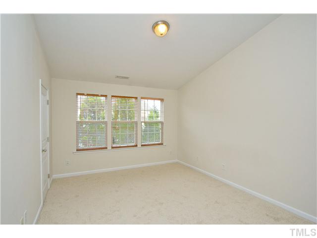 7843 Spungold Street Raleigh, NC 27617 - Photo 11 of 20 a view of an empty room with a window