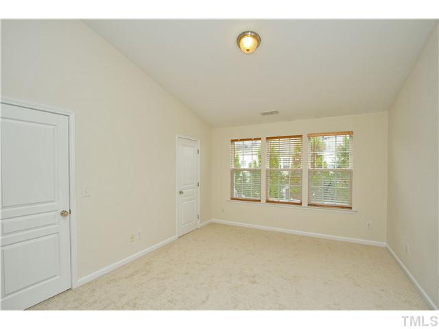 7843 Spungold Street Raleigh, NC 27617 - Photo 12 of 20 a view of an empty room with a window