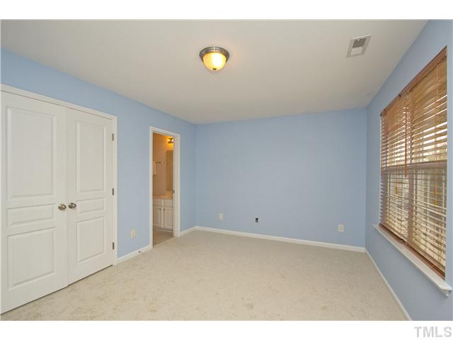 7843 Spungold Street Raleigh, NC 27617 - Photo 16 of 20 a view of an empty room and window
