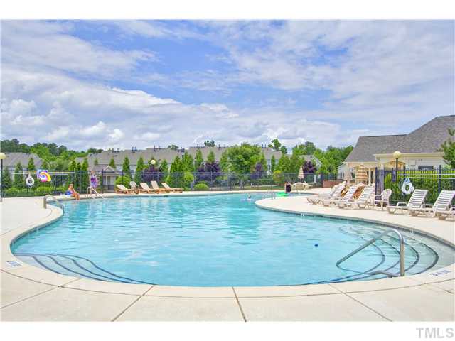 7843 Spungold Street Raleigh, NC 27617 - Photo 18 of 20 a view of a swimming pool with an outdoor seating