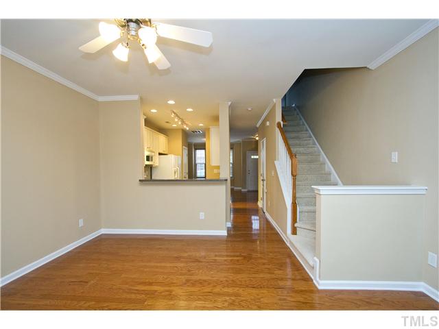 7843 Spungold Street Raleigh, NC 27617 - Photo 7 of 20 a view of a room with wooden floor and staircase