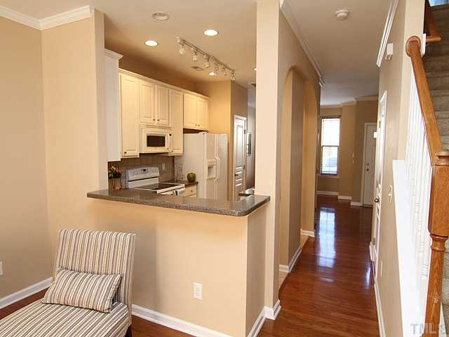 7843 Spungold Street Raleigh, NC 27617 - Photo 8 of 20 a view of a kitchen from the hallway