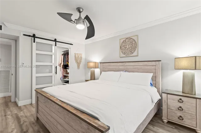 a bedroom with a bed and a walk in closet