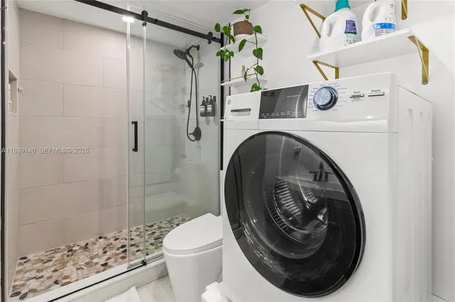 a bathroom with a shower and a toilet