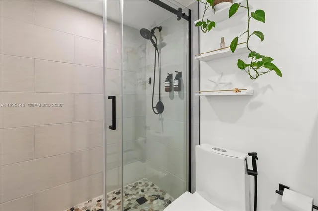 a view of a porch with plants and potted plants