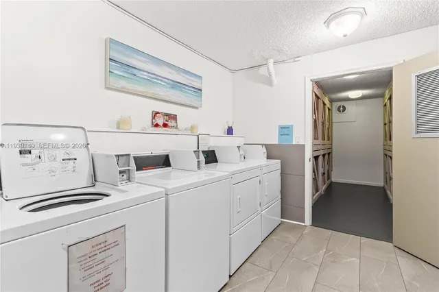 a utility room with a sink a washer and dryer