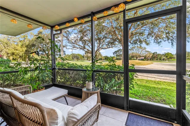 a view of a room that has a bed and a window