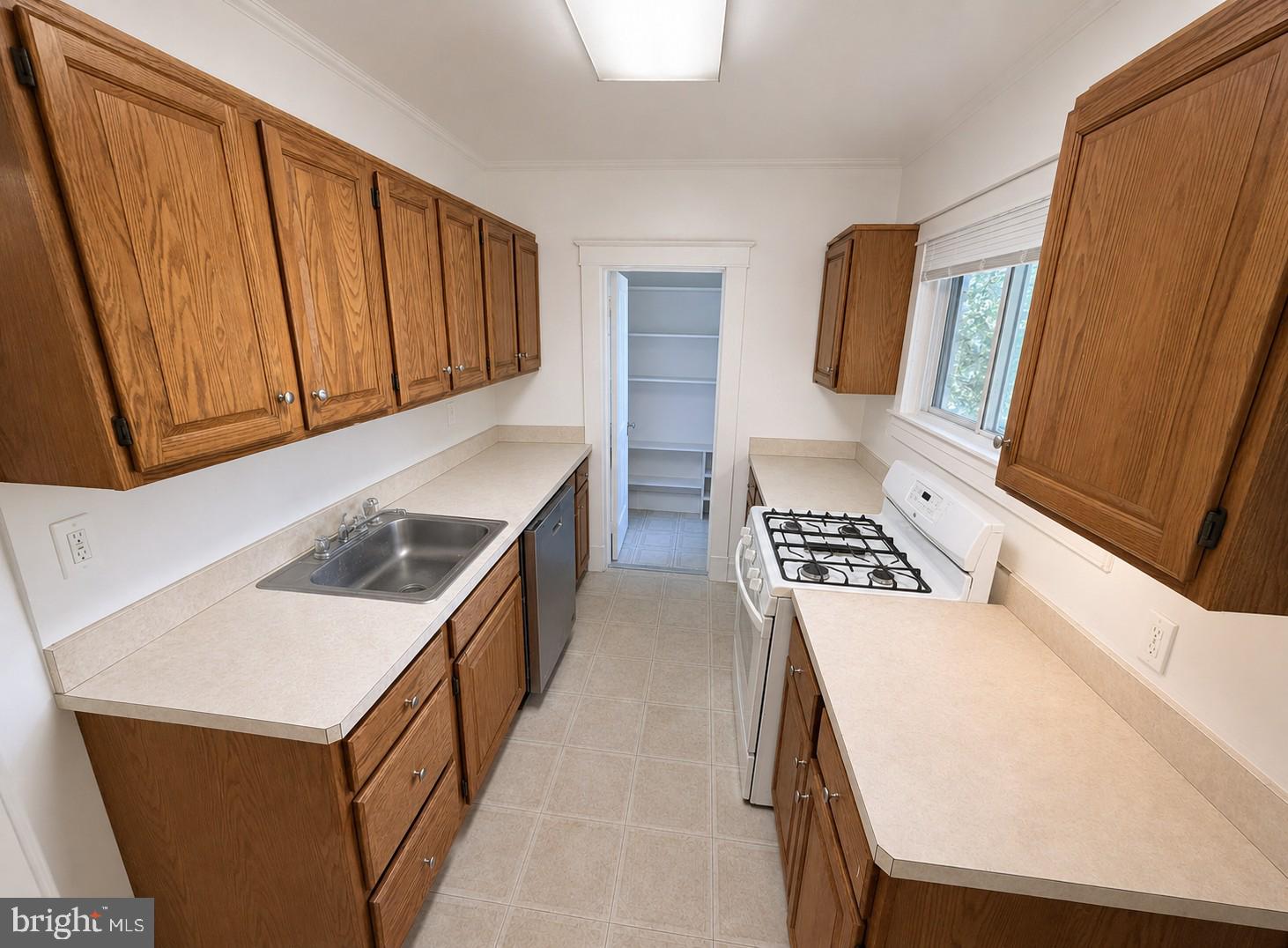506 Cedarcroft Road Baltimore, MD 21212 - Photo 5 of 16 a kitchen with a stove a sink and a refrigerator