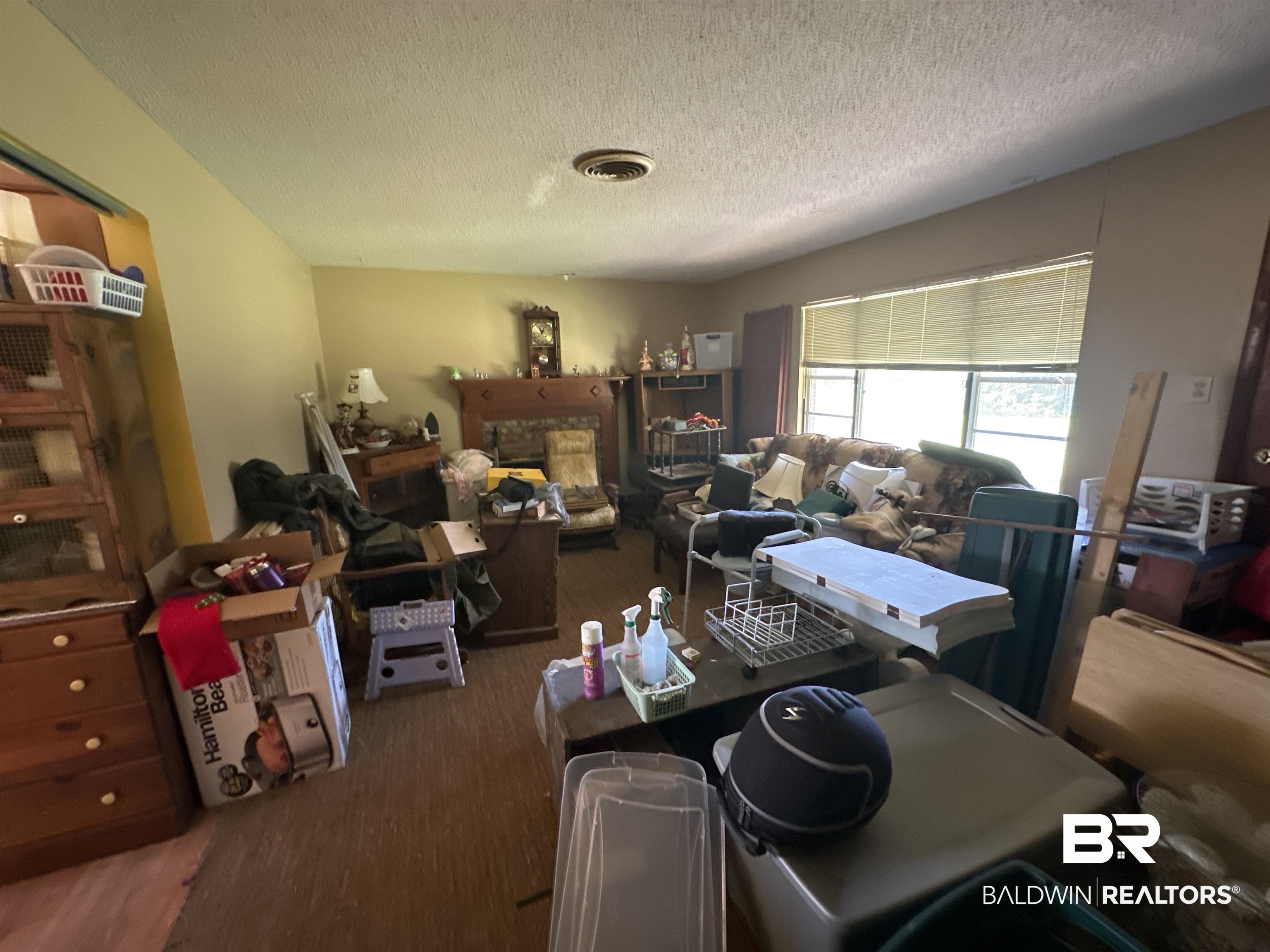 9520 C Four Mile Road Irvington, AL 36544 - Photo 24 of 32 Interior space with hardwood / wood-style floors and a textured ceiling