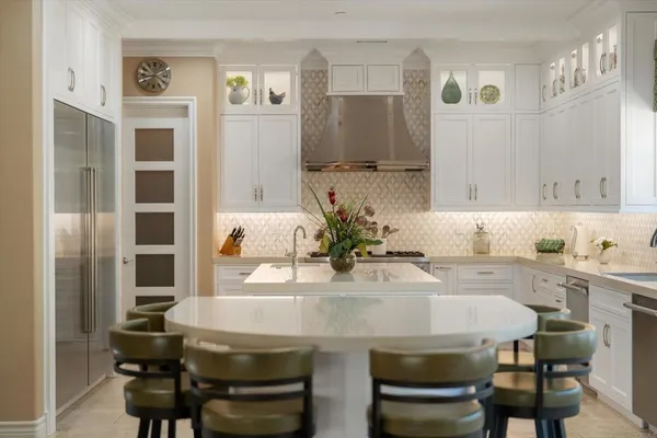 a living room with furniture and large windows
