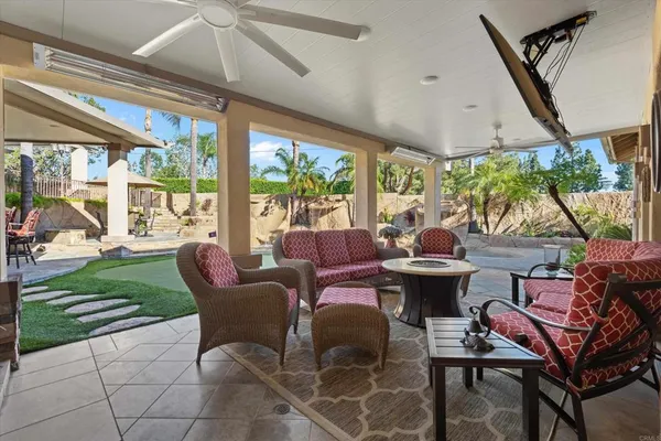 a view of a balcony with palm trees
