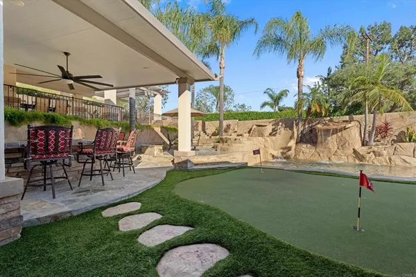 a dining room with furniture window and wooden floor