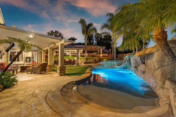 a view of a house with swimming pool