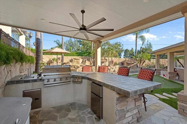 a en suite bathroom with a double vanity sink and a mirror