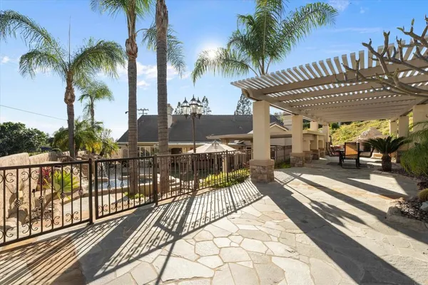 a spacious bathroom with a double vanity sink a large mirror and a bathtub