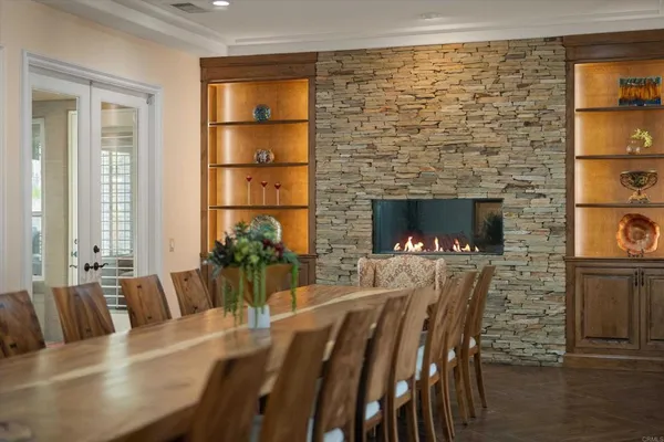 a bathroom with a granite countertop sink toilet a large mirror and shower