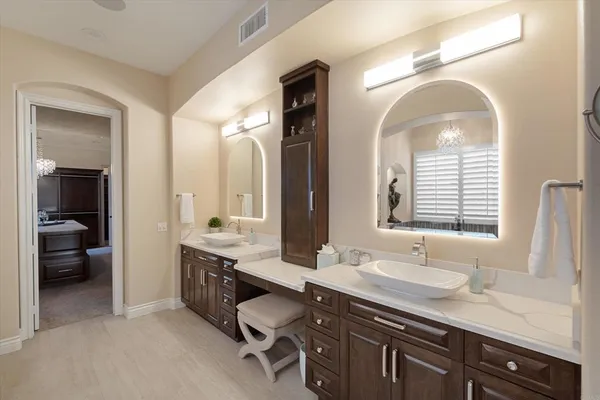 a room with pool table and windows