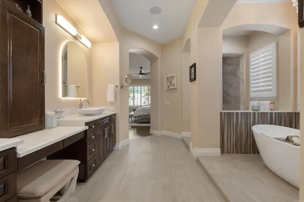 a projector room with furniture and a flat screen tv