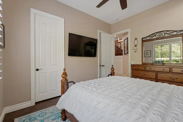 a view of a white house with a outdoor space and windows