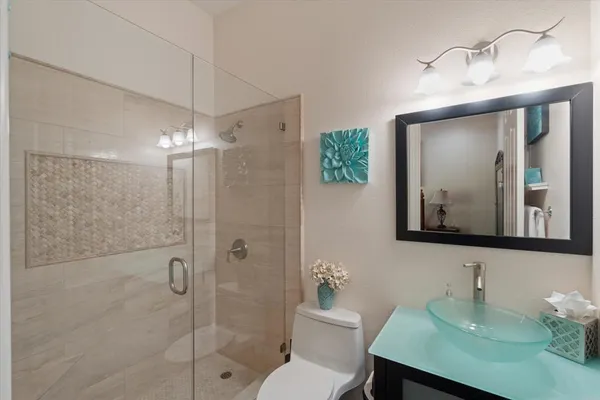 an aerial view of a house with a swimming pool